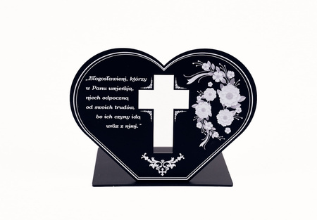 Podstawka pod znicz w kształcie serca w wyciętym krzyżem. Wykonana z czarnej matowej lub błyszczącej pleksi